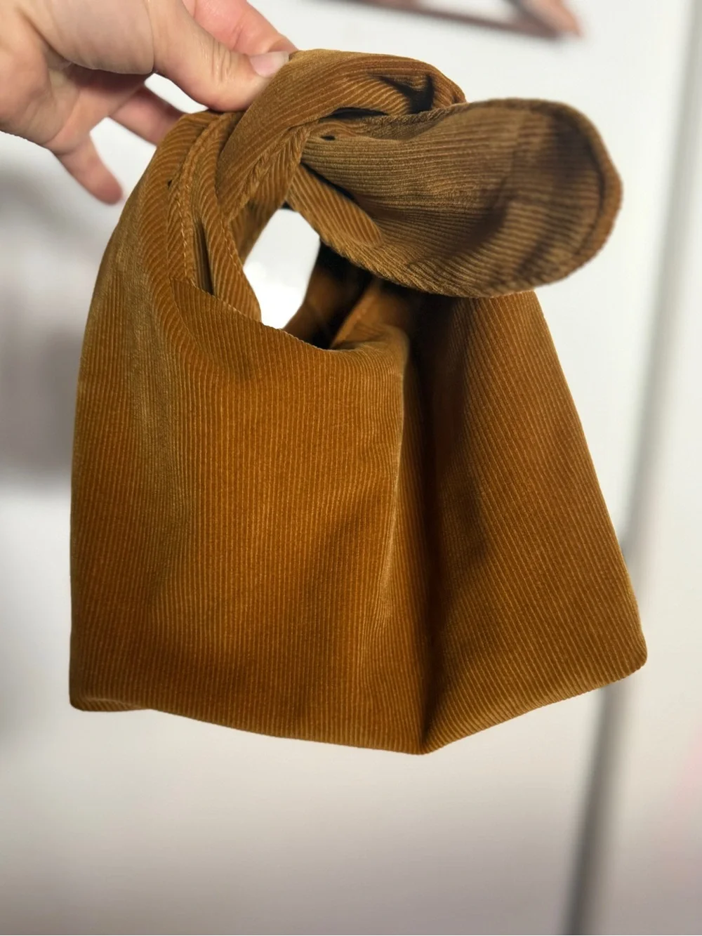 Merit Corduroy Knot Handle Cosmetic Pouch — Mustard